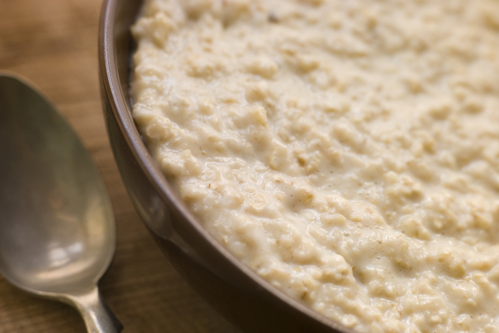 Close up of a bowl of porridge and a spoon