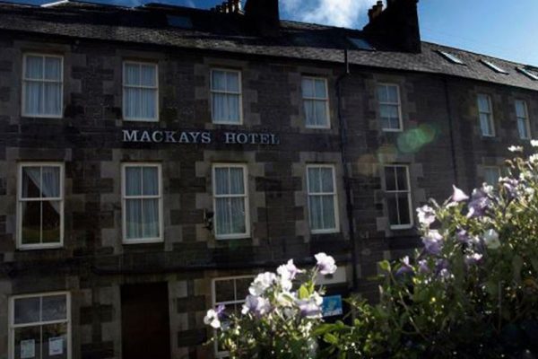 The exterior of Mackays Hotel on a sunny day