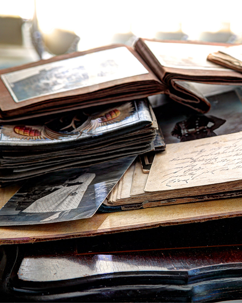 Old photo's and books piled on top of each other