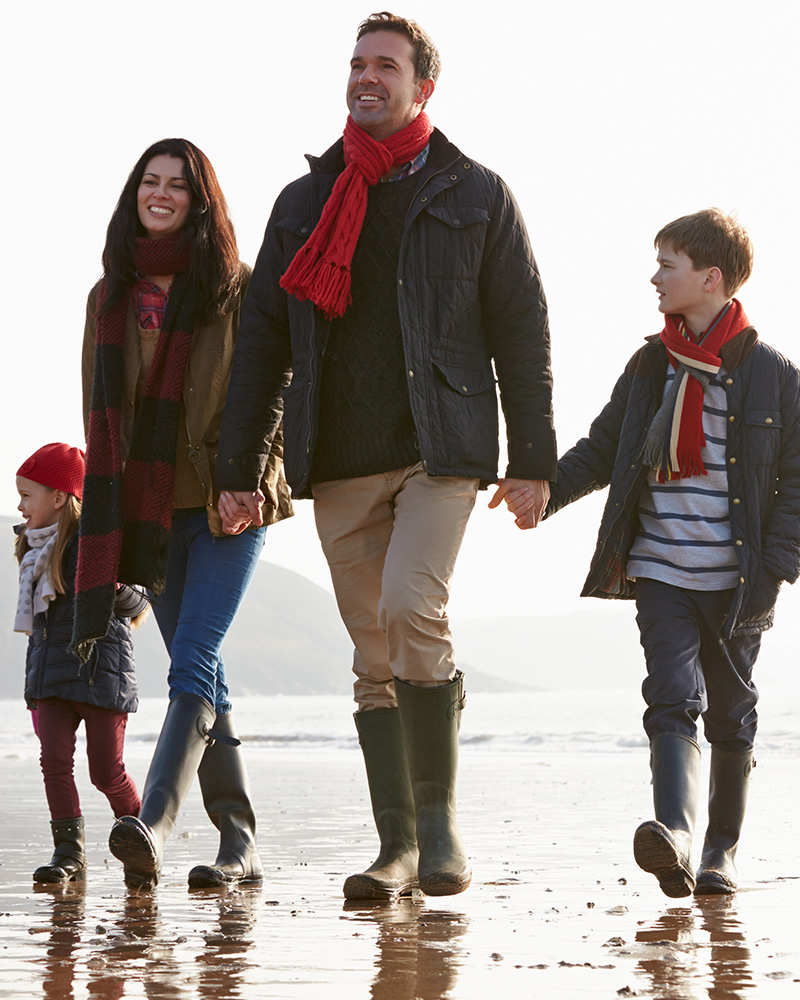 A family walking on a beach