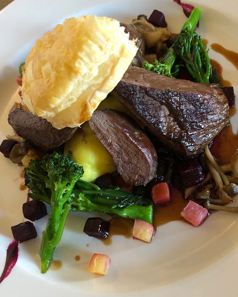 A plate of food included steak and vegetables at No 1 Bistro in Mackays Hotel