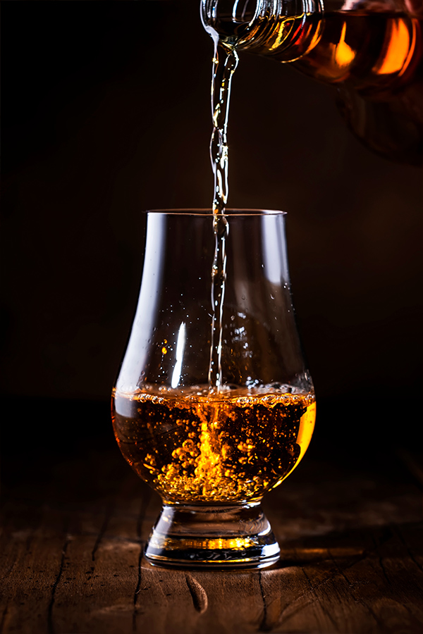 A dram of whisky being poured