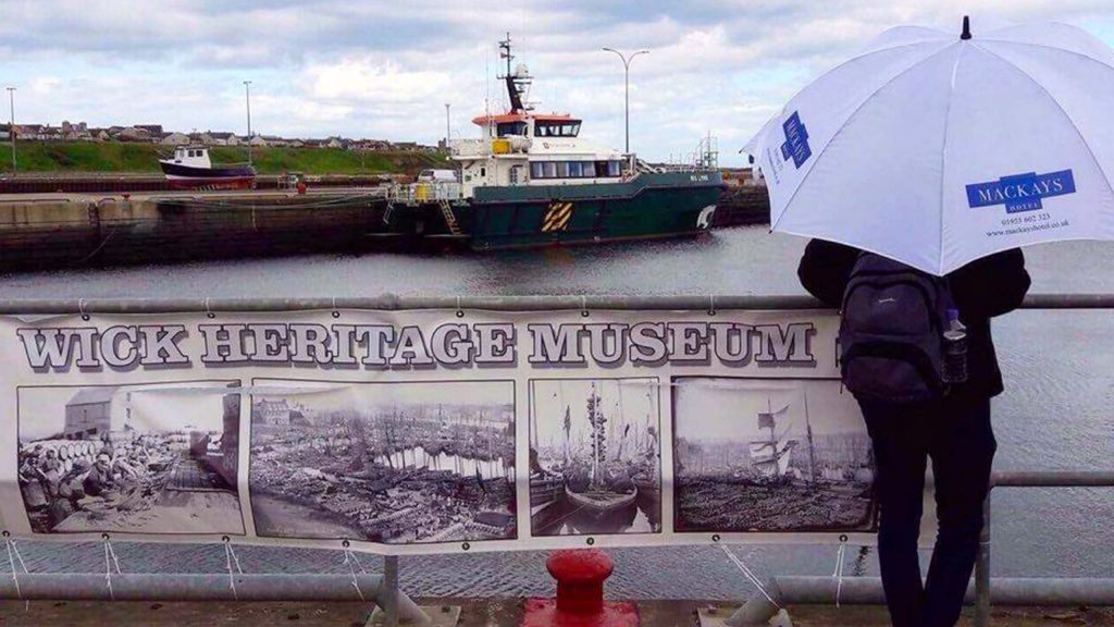 A sign for Wick Heritage and History Museum at Wick Harbour