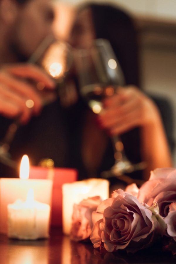 A couple enjoying a romantic dinner over candle light