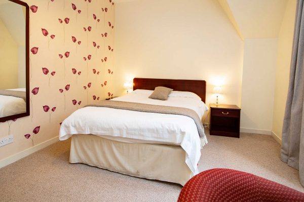 A double bedroom in a self catering apartment belonging to Mackays Hotel in Wick
