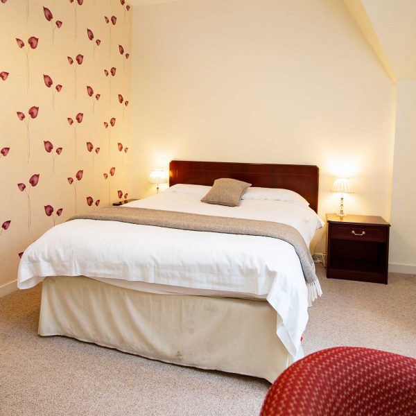 A double bedroom in a self catering apartment belonging to Mackays Hotel in Wick