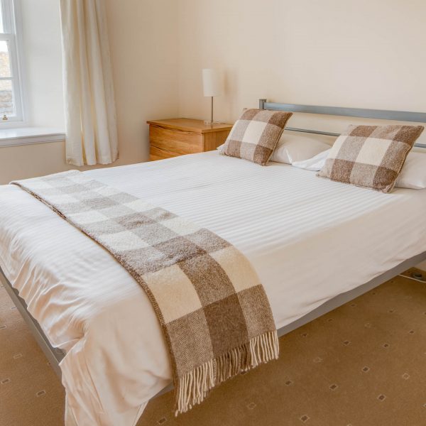 A double bedroom in a self catering townhouse belonging to Mackays Hotel in Wick