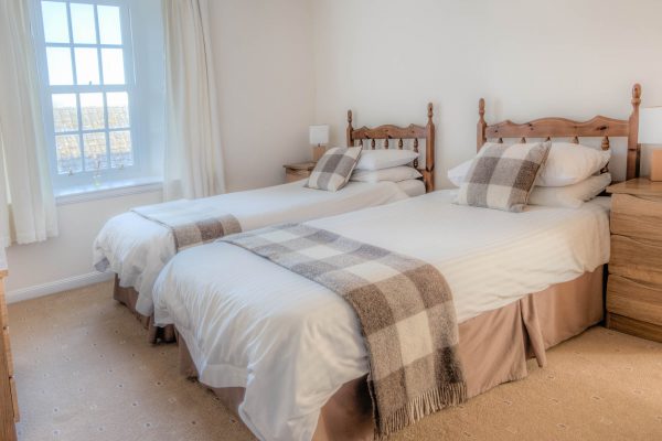 A twin room at our Townhouse self catering accommodation in Wick