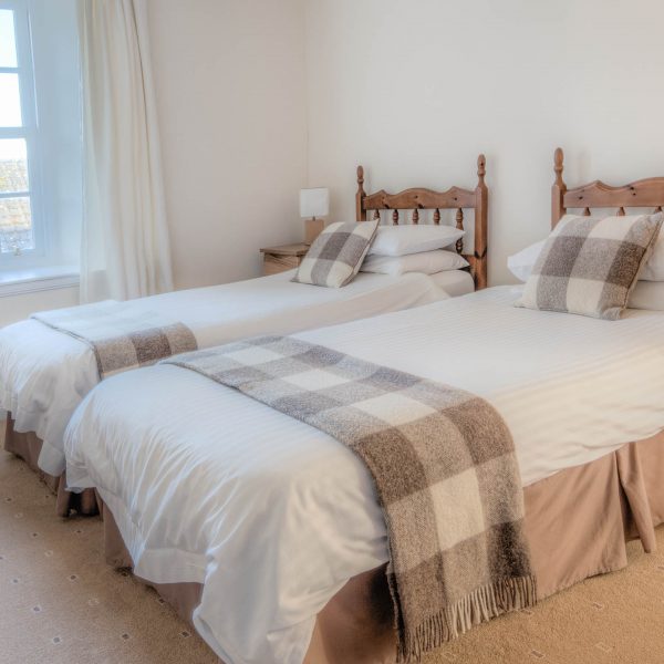 A twin room at our Townhouse self catering accommodation in Wick