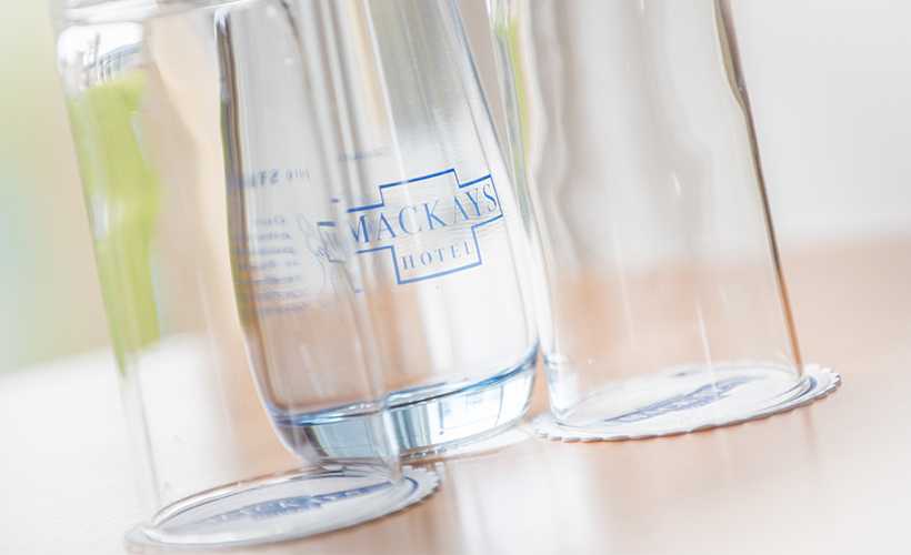 Water glasses in a room at Mackays Hotel