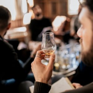 Four young men on a hotel whisky tasting experience at Mackay's Hotel