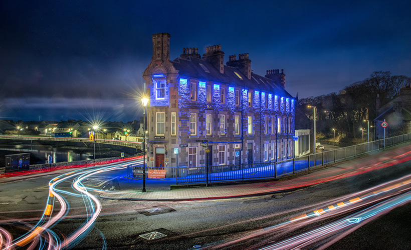 Mackays Hotel in Wick lit up at night