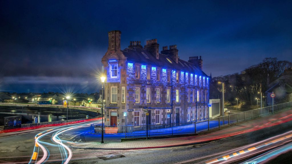 Mackays Hotel in Wick lit up at night