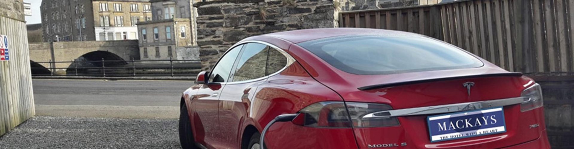 An electric Tesla car charing at Mackays Hotel in Wick