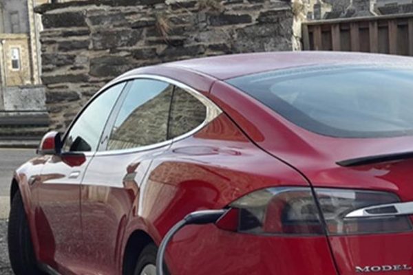 An electric Tesla car charing at Mackays Hotel in Wick