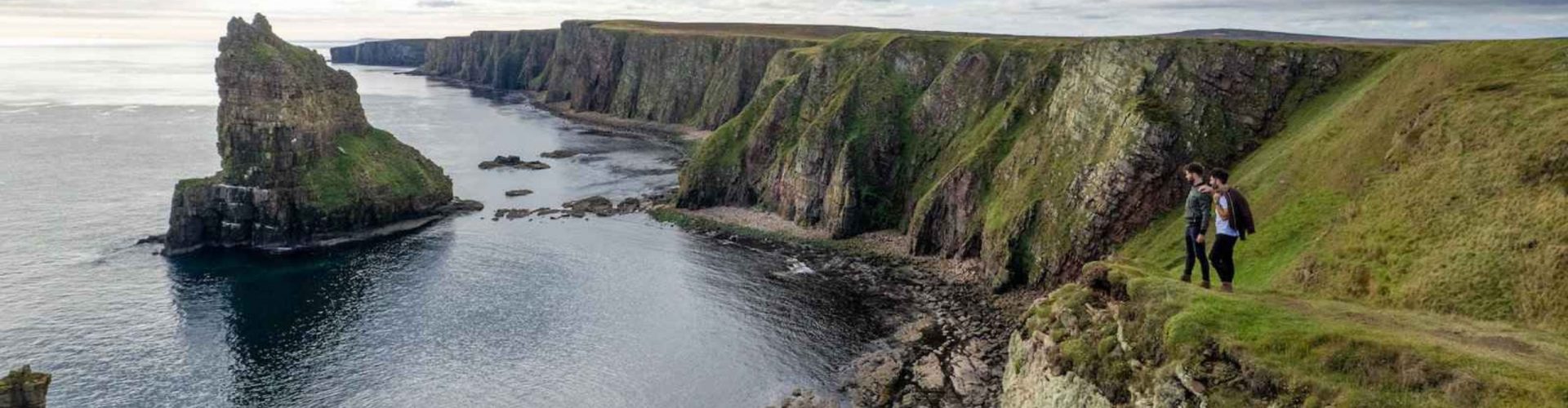 The nomadic boys gay travel bloggers at the Duncansby Stacks in Caithness, Scotland