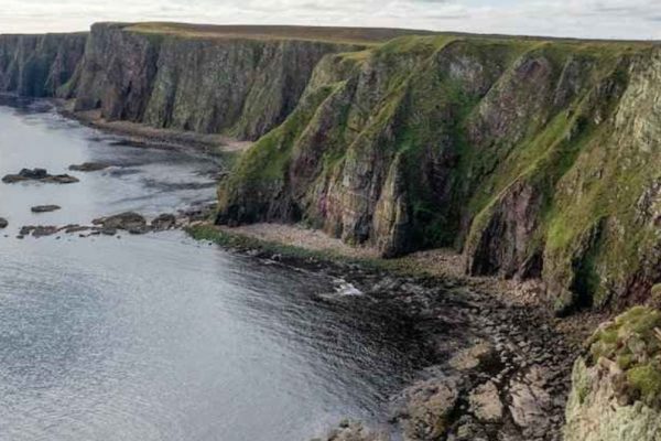 The nomadic boys gay travel bloggers at the Duncansby Stacks in Caithness, Scotland