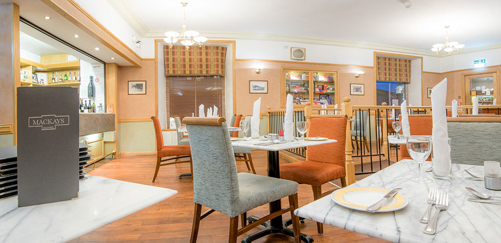 The No. 1 Bistro at Mackays Hotel with tables, chairs and a menu