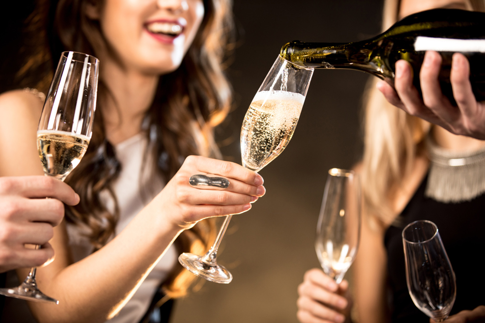 Guests having their Champagne topped up at an event