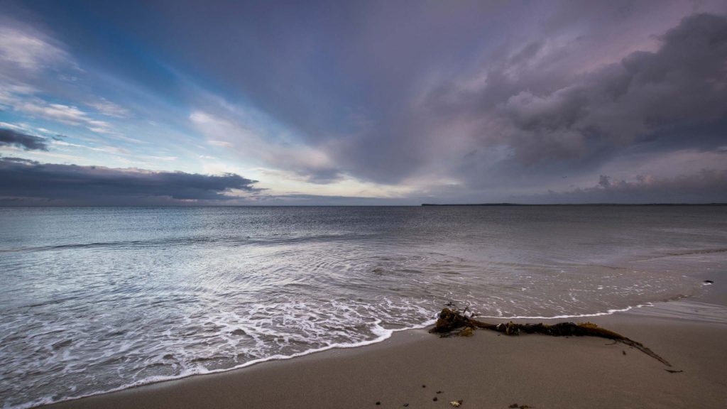 View of Keiss Beach Scotland at sunset