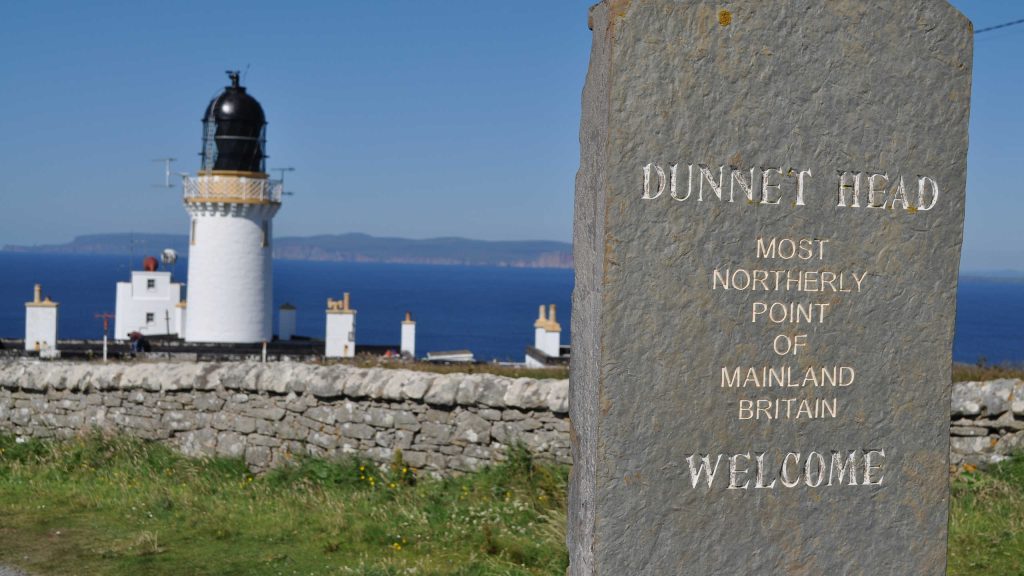 Dunnet Head Lighthouse and stone marking the most northerly point in mainland Britain
