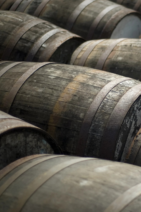 Lots of whisky barrels at a distillery