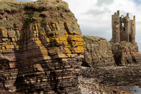 Keiss Castle and rocky cliffs in Caithness, Scotland