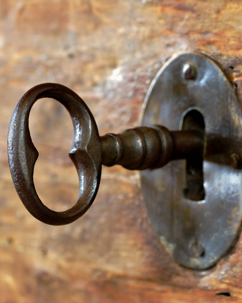 A metal key in a door