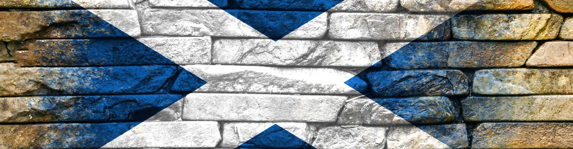 Saltire flag painted on a brick wall
