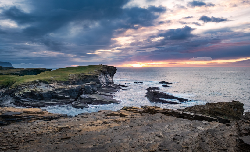 Sunset over headland in Orkney