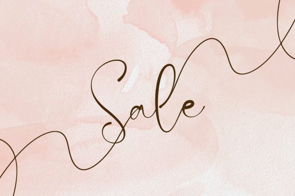 A pink backdround withthe word sale written across it