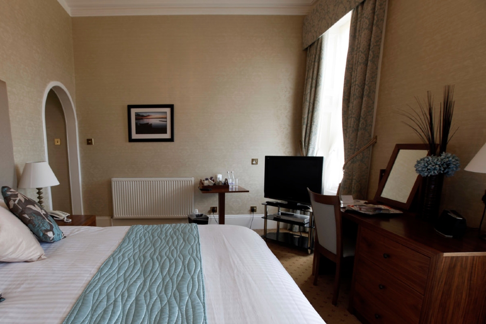 Interior photo of a Mackays superior room showing the desk area