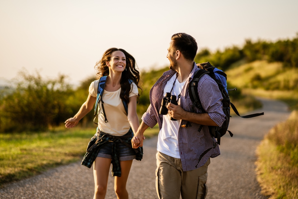 Happy couple is hiking on a mountain