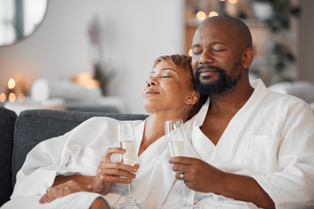 A couple in bath robes relaxing